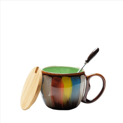 Cheerful ceramic coffee cup with lid and spoon