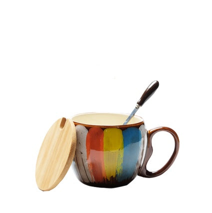 Cheerful ceramic coffee cup with lid and spoon
