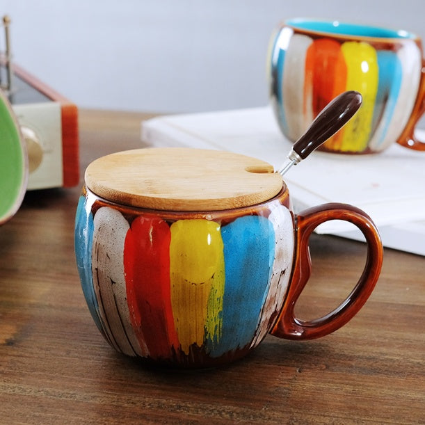 Cheerful ceramic coffee cup with lid and spoon
