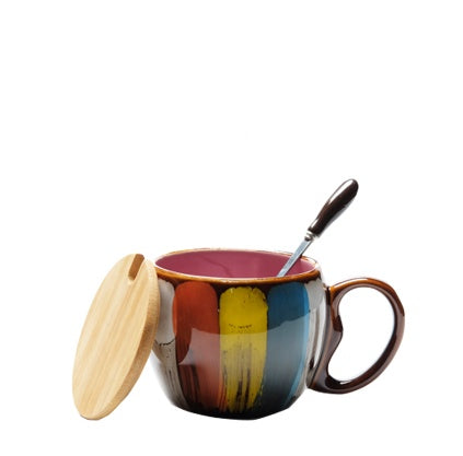 Cheerful ceramic coffee cup with lid and spoon