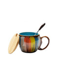 Cheerful ceramic coffee cup with lid and spoon